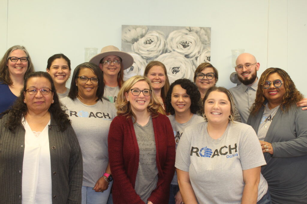 REACH Staff all standing together and smiling